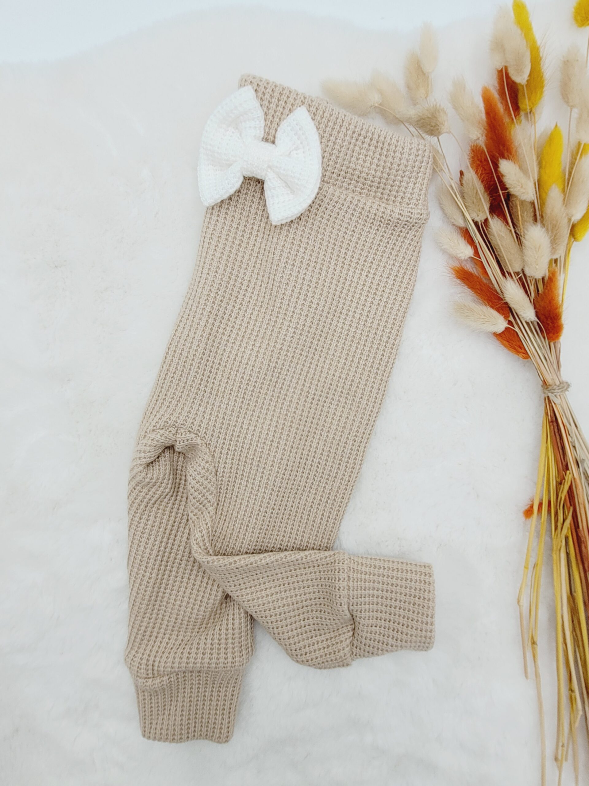 Spodnie dziecięce z kokardką beż