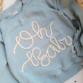 Bluza-z-napisem-oh-baby-brudny-niebieski-scaled-1.jpg