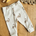 Legginsy-prazkowane-dzieciece-dinozaury-scaled-1.jpg