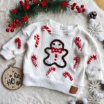 Sweterek świąteczny dla dziecka ludzik z piernika ecru
